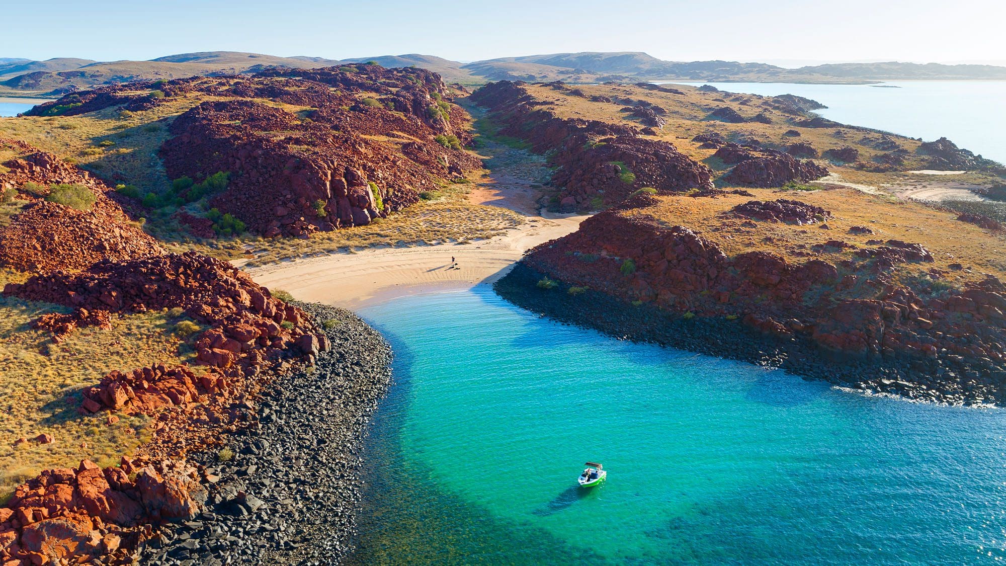 Boat in a turquoise bay in remote North-West Australia