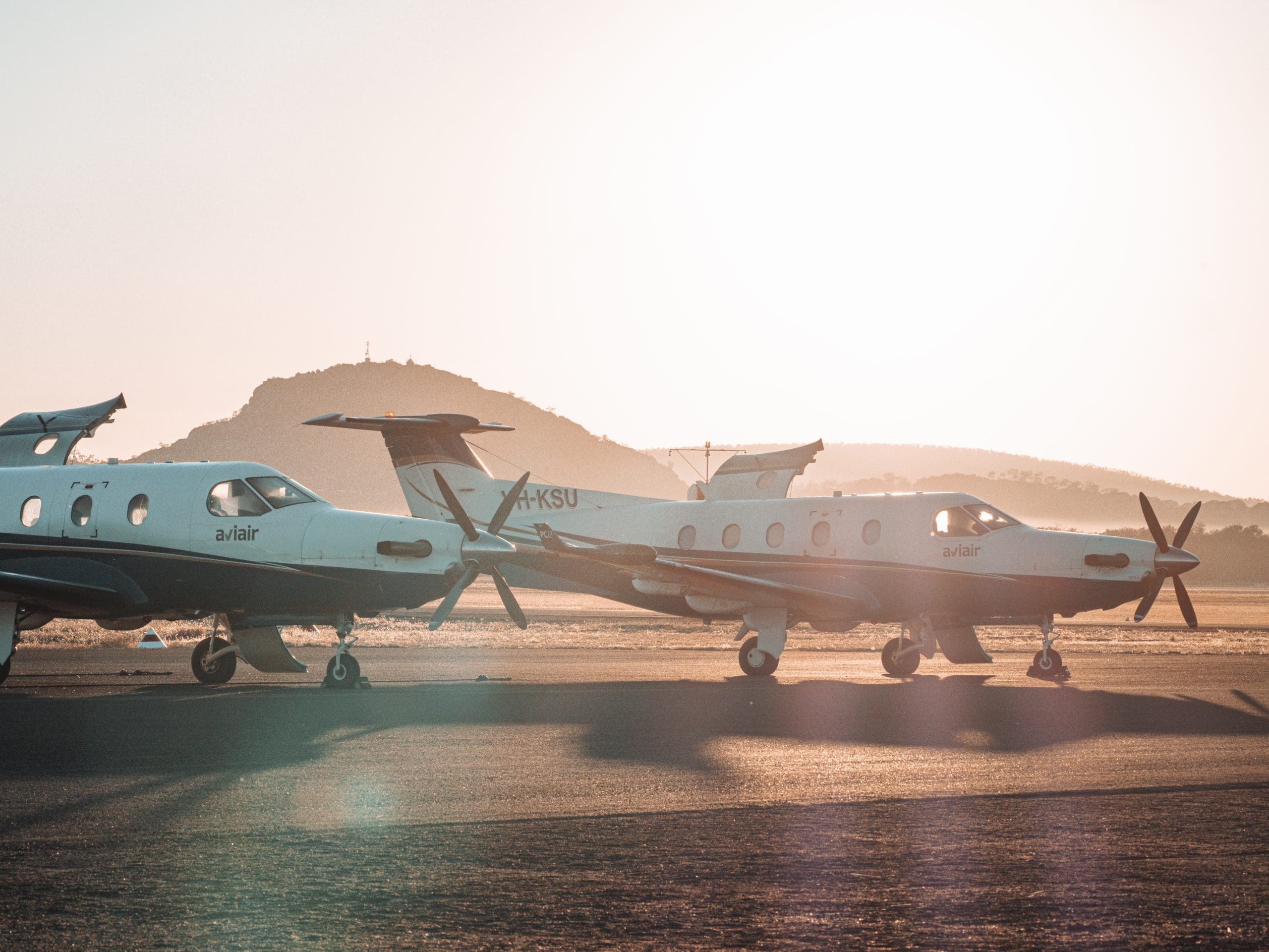 Two Nexus Airlines airplanes sitting stationary